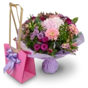 Bouquet of hydrangeas and germini in water packaging